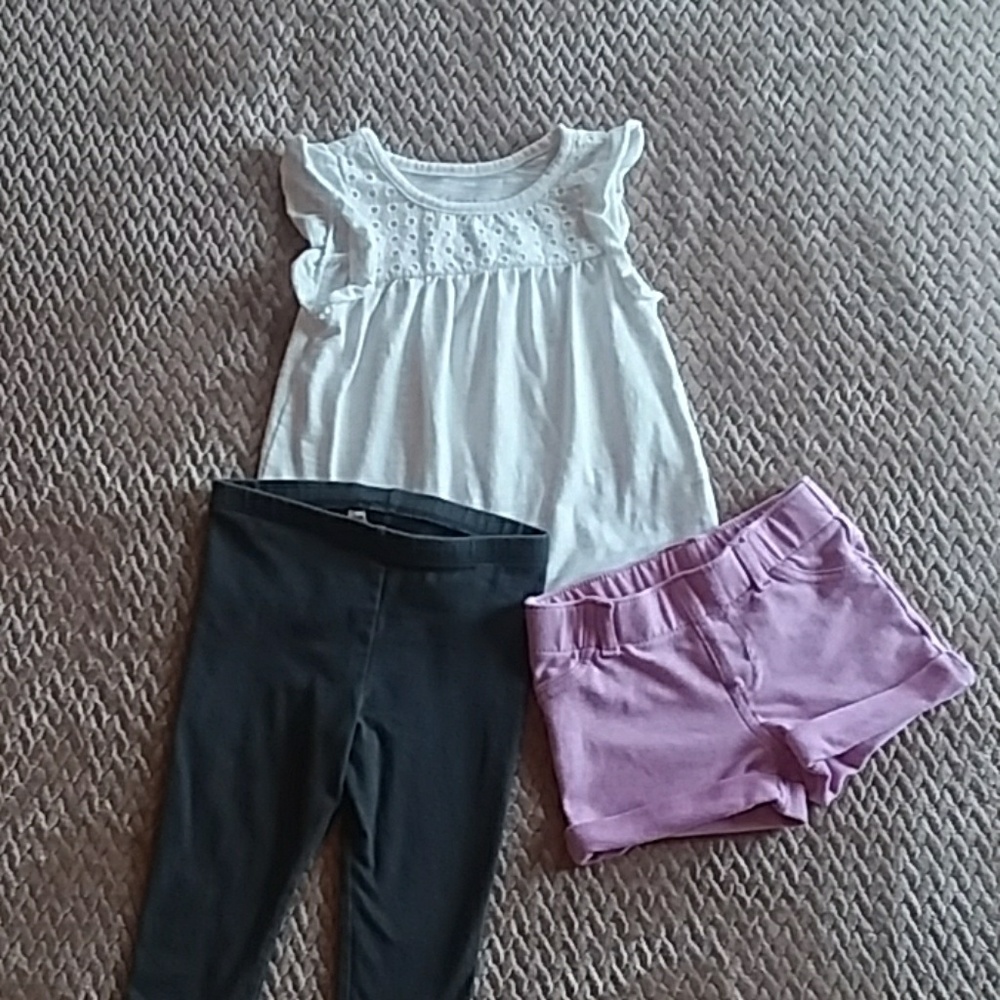 Girls top with grey leggings and purple shorts